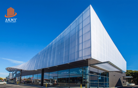 Modern building under construction featuring polycarbonate window panels replacing traditional glass.